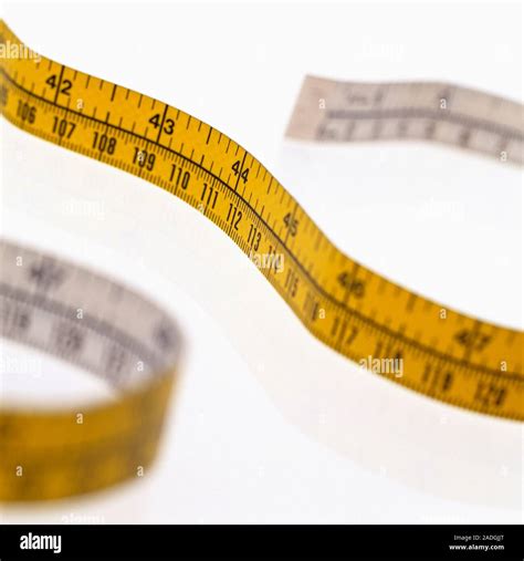 Tape Measure Marked With Inches And Centimetres Stock Photo Alamy