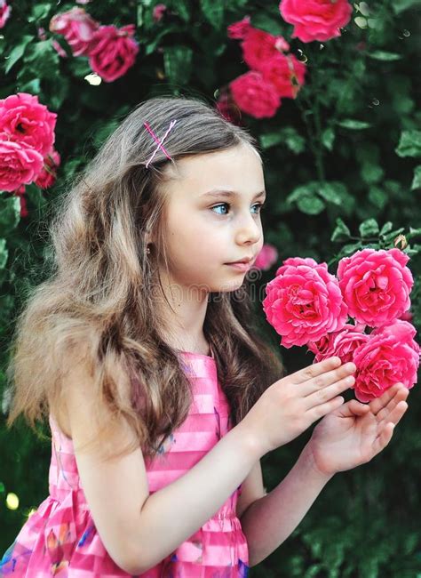 Beautiful Little Girl With Roses Outdoors Stock Photo Image Of