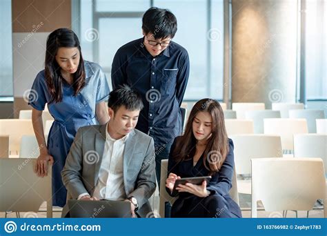 Asian Colleagues Discussing In Conference Room Stock Photo Image Of