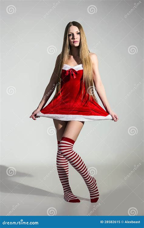 Сексуальная девушка одетая как Дед Мороз Стоковое Изображение изображение насчитывающей