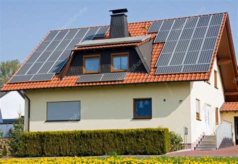 House With Solar Panels — Stock Photo © Elxeneize 9555645
