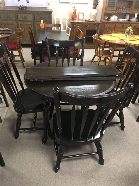 The chairs are black wooden with a leather (faux) top and with stainless steel rectangular legs. Dining with leaf and four matching chairs. | Used dining ...