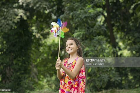 Young Girl Holding Pinwheel High Res Stock Photo Getty Images
