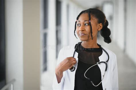 Beautiful African American Female Pediatric Nurse In Modern Office