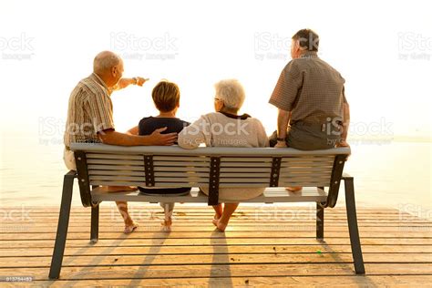 Back View Senior Friends At Lake Close Stock Photo Download Image Now
