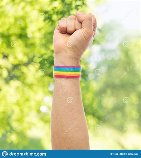 Hand With Gay Pride Rainbow Wristband Shows Fist Stock Image Image Of