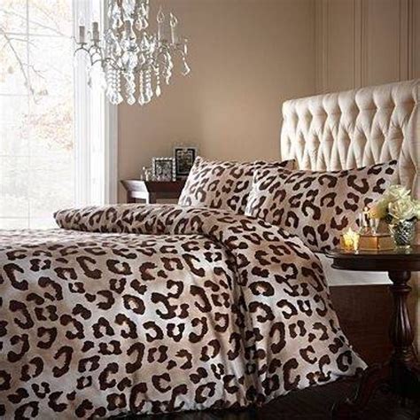 A Leopard Print Comforter Set On A Bed