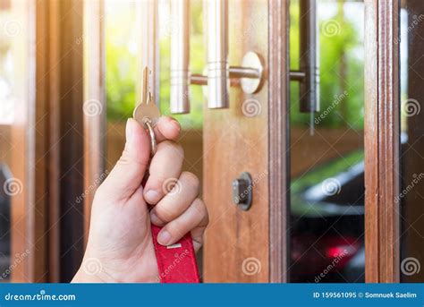 Key On Hand Of People Open The Door To Inside Outside Door Open