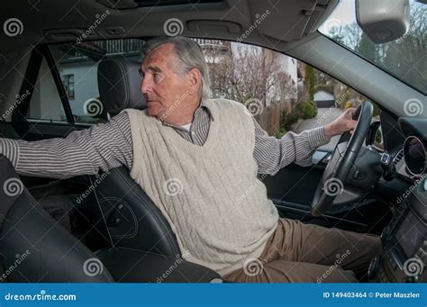 Senior Man Backing Up In Car Stock Photo Image Of Turning Drive