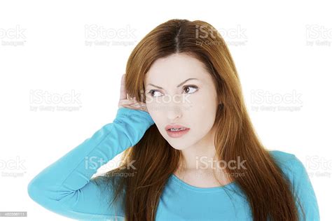 Young Casual Woman Is Listening Carefully Stock Photo Download Image