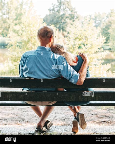 Rear View Of Senior Couple Sitting On Bench In Park Hi Res Stock Photography And Images Alamy
