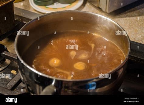 Gravy Simmering In A Saucepan On A Hob Stock Photo Alamy