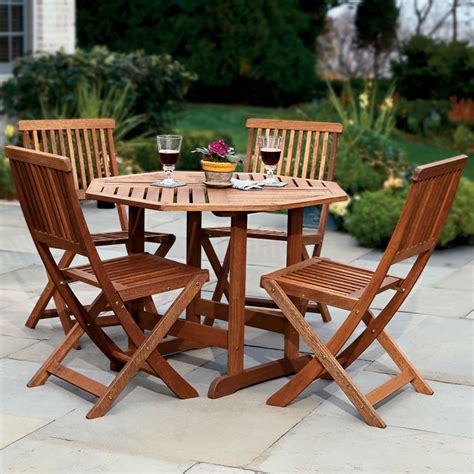 Find patio tables at wayfair. The Trestle Patio Table and Stow Away Chairs - Hammacher ...