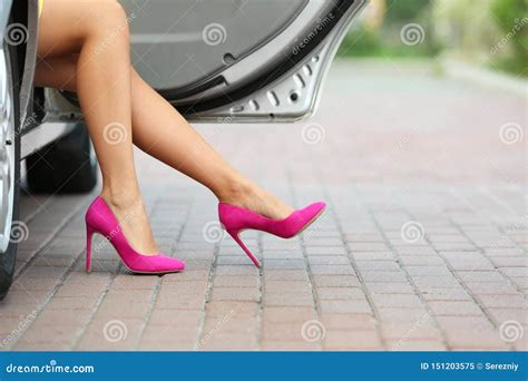 Young Woman With Slim Legs In High Heels Getting Out Of Car Stock Image Image Of Background