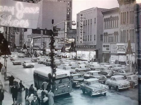 An Old Black And White Photo Of Cars On A City Street In The 1950s