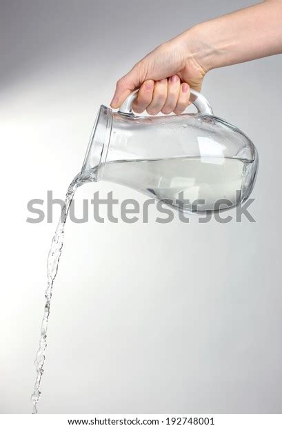 Pouring Water Glass Pitcher Isolated On Stock Photo 192748001