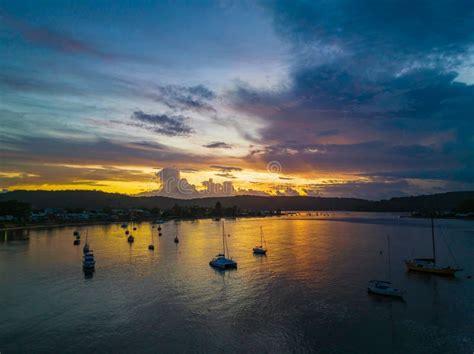 Aerial Sunrise Waterscape With Boats Colour And Clouds Stock Photo
