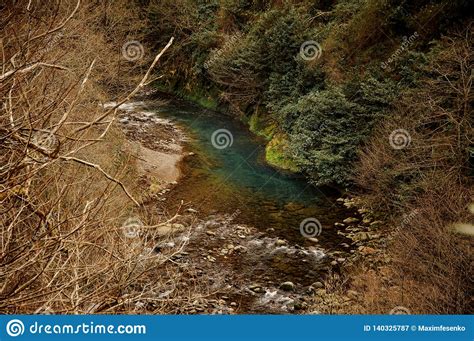 Beautiful Landscape Of The Wild Mountain Blue River Among The Dry And