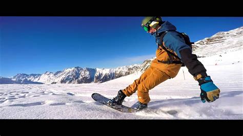 Snowboarding is a sport that involves descending a slope that is covered with snow on a snowboard attached to a rider's feet using a special boot set onto mounted binding. GoPro: Snowboarding Ischgl 2016 - White dreams - YouTube