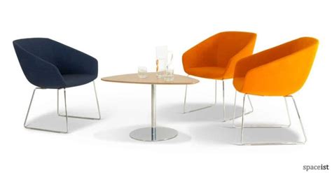 Modern would be very very basic and full of clear glass. colourful reception chairs - modern reception armchairs