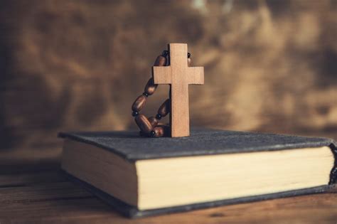 Premium Photo Prayer Woman Holding Cross On Bible