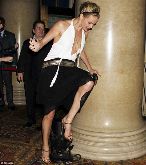 Charlize Theron Almost Takes A Tumble As She Trips In Daring Dress At