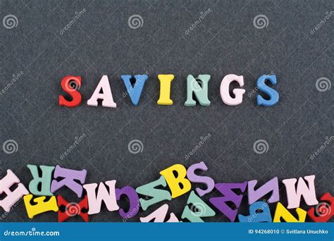 SAVINGS Word On Black Board Background Composed From Colorful Abc