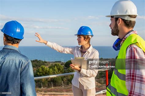 Architect Woman Giving Instructions On Construction Site High Res Stock
