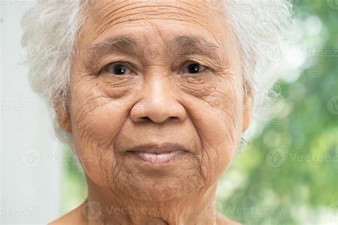 Asian Elderly Old Woman Face And Eye With Wrinkles Portrait Closeup