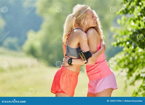 Two Young Women Hug Each Other Stock Image Image Of Embrace Nature 109271995