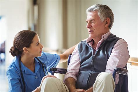 Nurse Taking Care Of Sad Senior Man In A Retirement Home Cna Classes