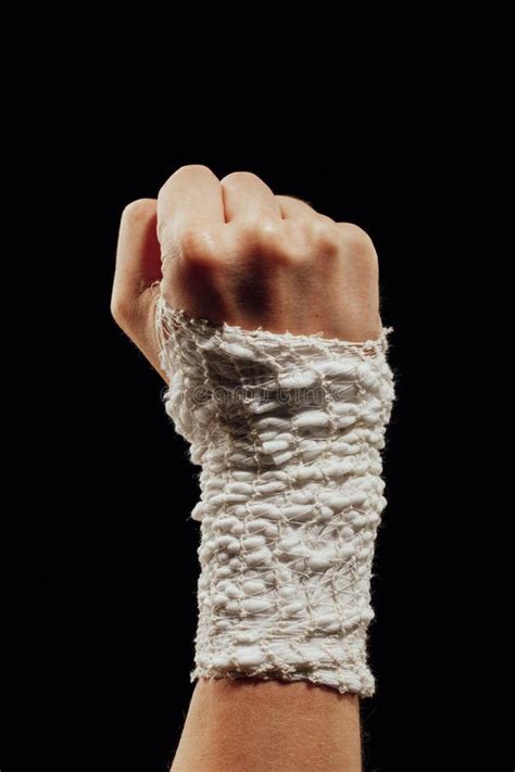 Wrist Wrapped With Healing Bandage Isolated On Black Stock Photo