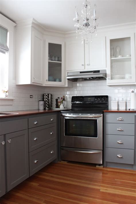 Opt for deeper and darker units with contrasting bright flooring and walls. modern jane: Two-Tone Cabinets Reveal.