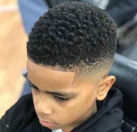 You can opt for eccentric styles that give a lot of style, but also, shorter and worked, more discreet and refined hairstyles. 60 Little Black Boy Haircuts - MrKidsHaircuts.Com