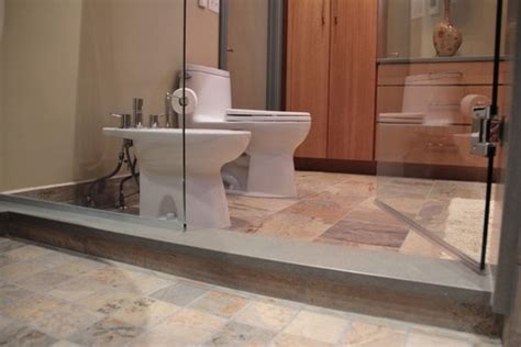 Plus you'll see how to start the layout and tile a shower bench with subway tile. Another photo of using Quartz for the shower curb ...