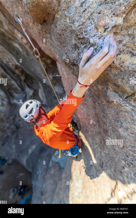 Practicing Rock Climbing Extreme Sport Inside Andes Mountains At A Rock