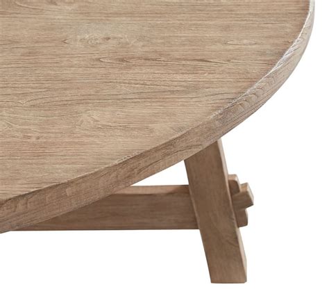 It looks like a driftwood type finish that has warm undertones and a minimal wood grain pattern. Toscana Round Extending Dining Table - Seadrift | Pottery Barn