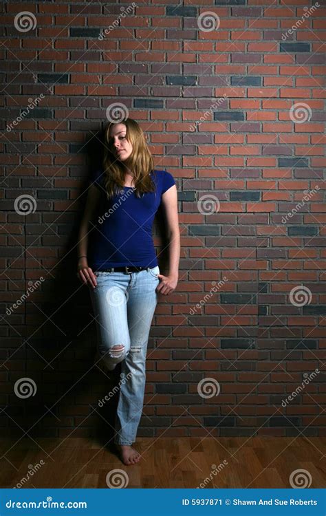 Woman Leaning Against Brick Wall Stock Image Image Of Mood Wall 5937871
