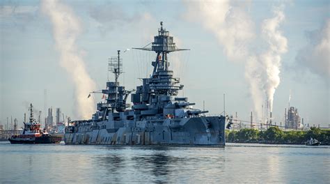 Pilot Boat Tows The Battleship Uss Texas Down The Houston Ship Channel