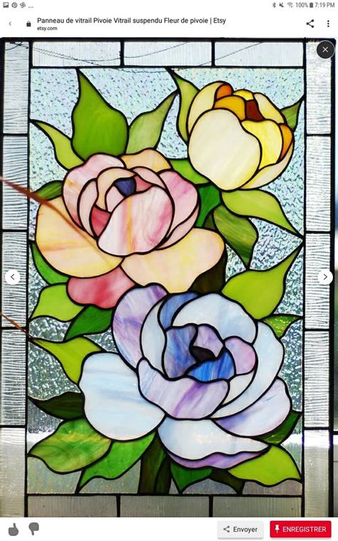 A Stained Glass Window With Flowers On It