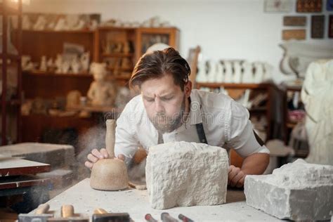 Craftsman Hands Working With Stone Sculptor At Creative Workplace In