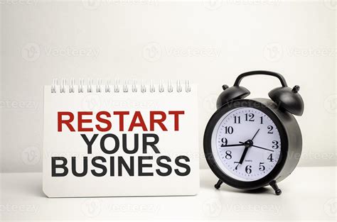 Restart Your Business Words With Calculator And Clock With Notebook