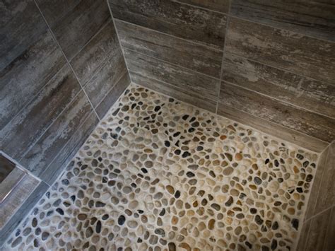 When it comes to retiling a shower, or planning a new bathroom remodel from scratch, many homeowners are overwhelmed by the array of options for tile. 27amazing bathroom pebble floor tiles ideas and pictures