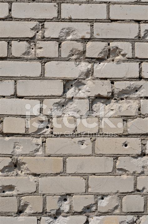 Brick Wall With Bullet Holes Stock Photos
