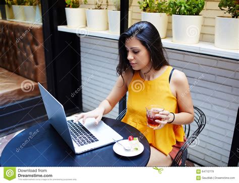 Portrait Of A Young Female Freelancer Using Laptop