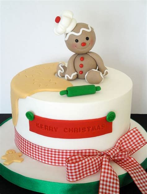 How pretty is this white and wonderful cake? Christmas Cake with very Cute Topper - Amazing Cake Ideas