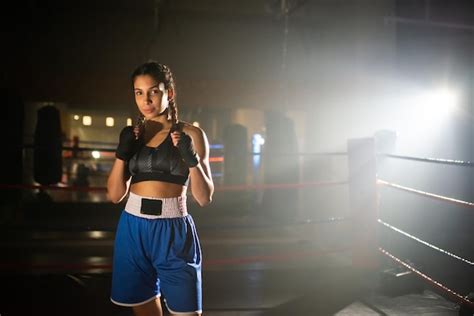 Free Photo Portrait Of Young Female Boxer Posing For Camera In Gym
