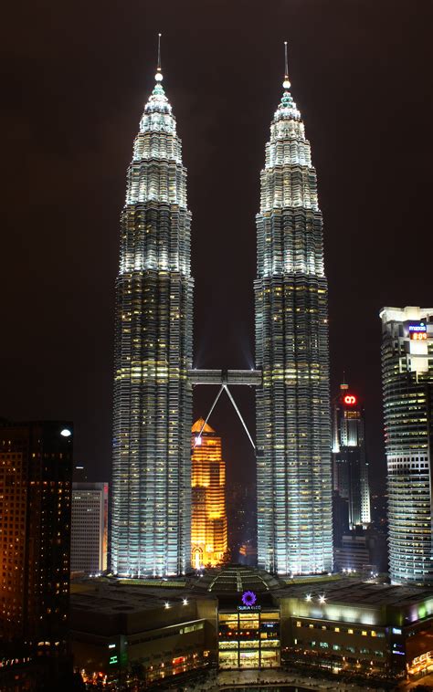 In fact, petronas twin towers both rise to a height of 1,483 feet, which includes 242 feet for pinnacle and spire. File:Petronas Towers, Kuala Lumpur (3323152170).jpg ...