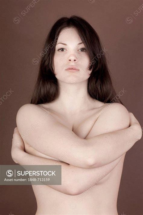 Woman Naked Upper Body Embracing Herself Superstock