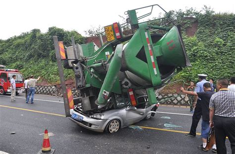 Crash In China Sees Car Flattened By A Cement Mixer As Driver And